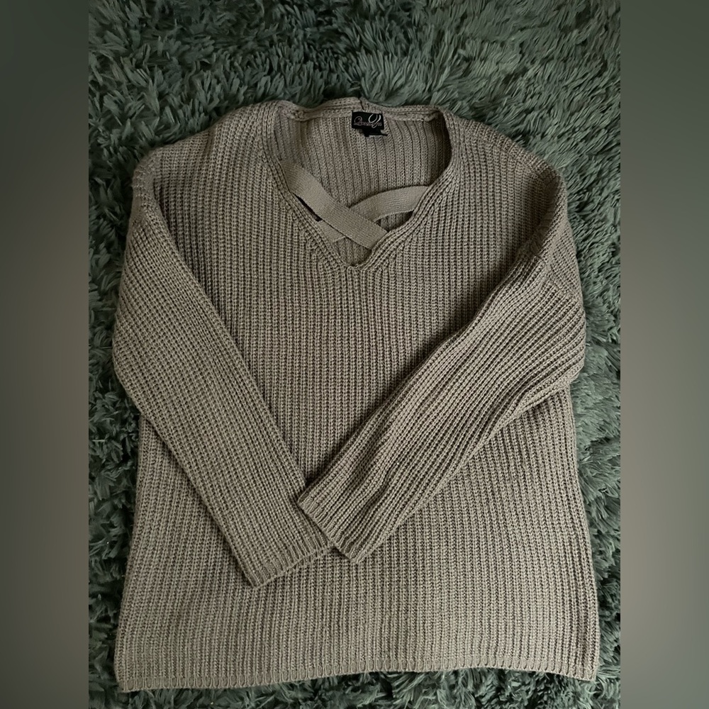 Sweater with criss-cross neckline